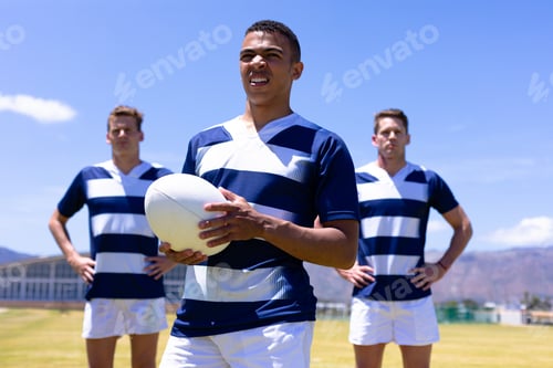 Preview: Rugbymen standing with ball