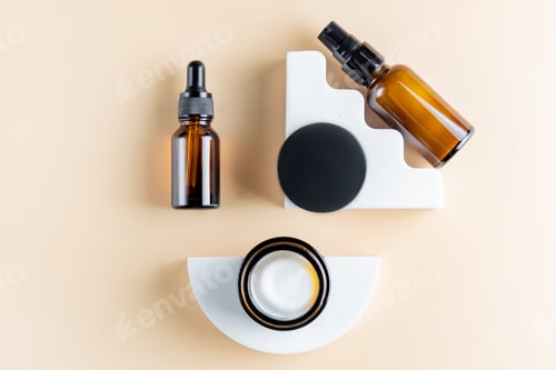 Preview: Trendy presentation of cosmetic set for skin care. Top view of dark glass packaging - dropper bottle
