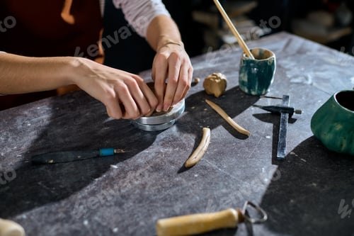 Preview: Crafting unique pottery creations in a cozy studio filled with artistic inspiration and joy