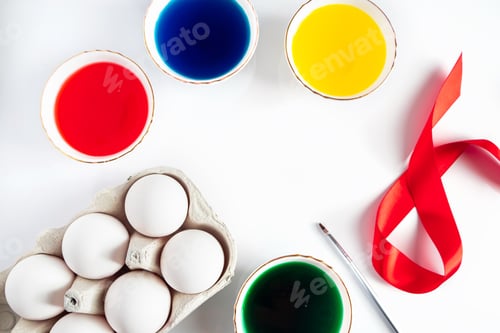 Preview: The process of preparing for painting eggs for Easter on a white background.