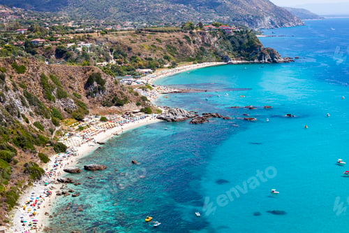 Preview: Amazing tropical panoramic view of turquoise gulf bay, sandy beach, green mountains and plants.