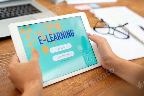 Preview: Touchpad held by young female student of educational website