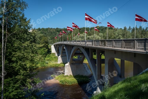 Preview: Bridge over Gauja River with Latvian Flags - Sigulda, Latvia