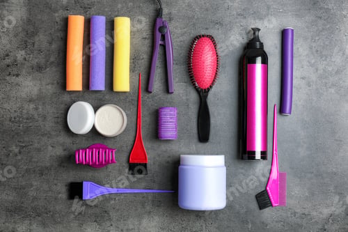 Preview: Flat lay composition with professional hairdresser tools on grey background