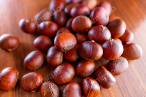 Preview: Stack of fresh raw chestnuts