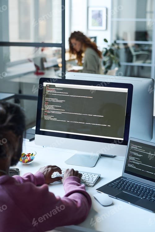 Preview: Man working with codes on computer