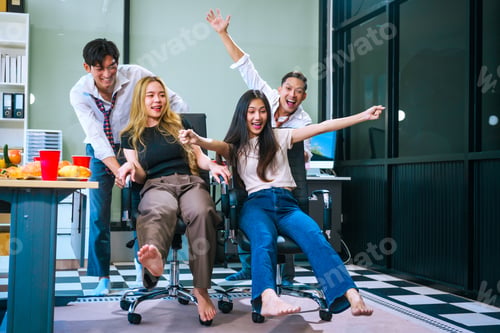 Preview: Four Asian friends, two men and two women, celebrate in an office party. They enjoy a fun-filled