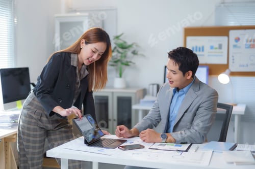 Preview: Business professionals collaborating on digital presentation