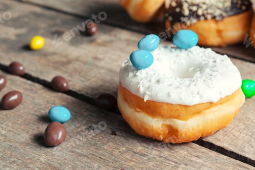 Preview: Glazed donuts on wooden background