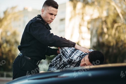 Preview: Police officer arrests the driver violator on road