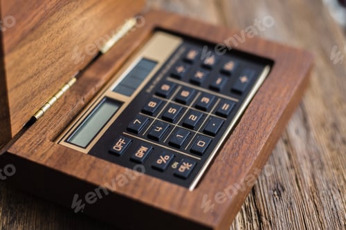 Preview: Calculator closeup on wooden background