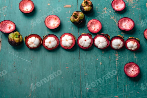 Preview: Mangosteen fruit on light blue wooden background,Tropical fruit
