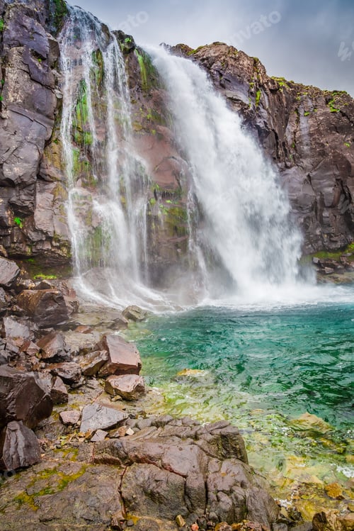 Preview: Waterfall in the mountains in Iceland in summer
