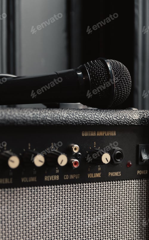 Preview: Close-up photo of microphone on vintage guitar amplifier