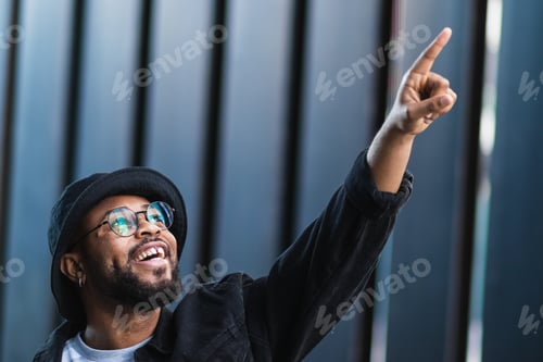 Preview: Excited black man pointing up