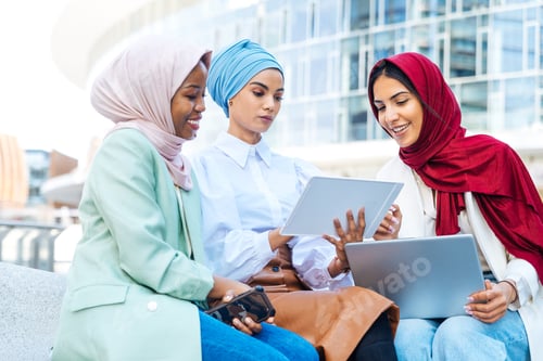 Preview: Beautiful muslim girl wearing hijab bonding outdoors