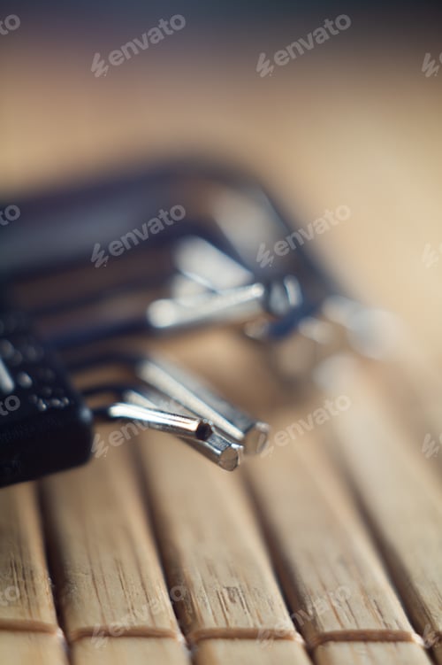 Preview: Vertical closeup shot of different sizes of screwdrivers on a wooden surface