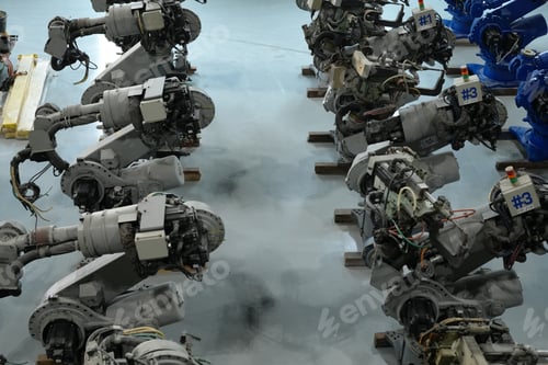Preview: Robotics engineer working on maintenance of robotic arm in factory warehouse. Business technology.