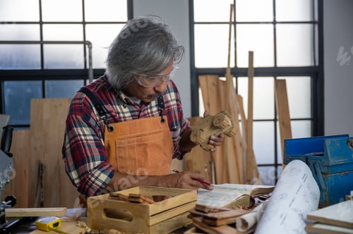 Preview: A carpenter is making crafts from wood.