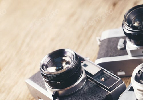Preview: vintage old film camera on wood board