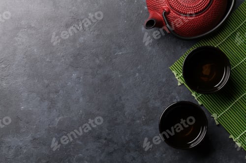 Preview: Teapot and cups with herbal tea