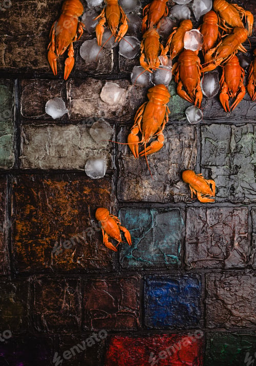 Preview: close-up view of gourmet lobsters with ice cubes on brick wall surface