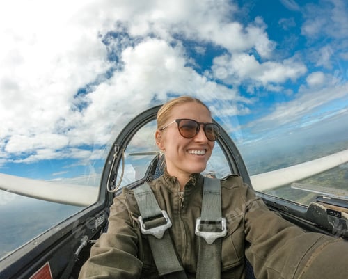 Preview: Woman flying there glider airplane
