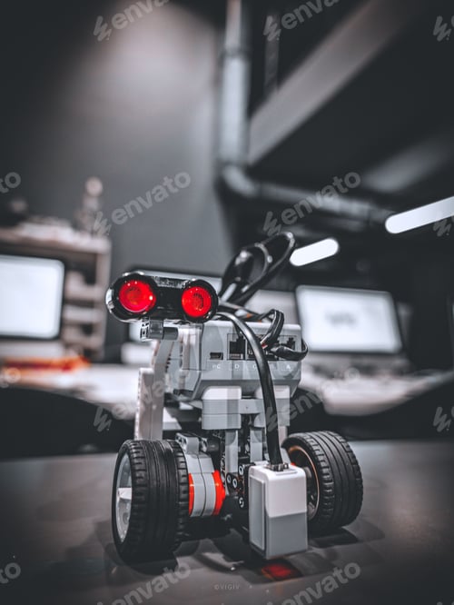 Preview: Lego robot with wheels in the studio