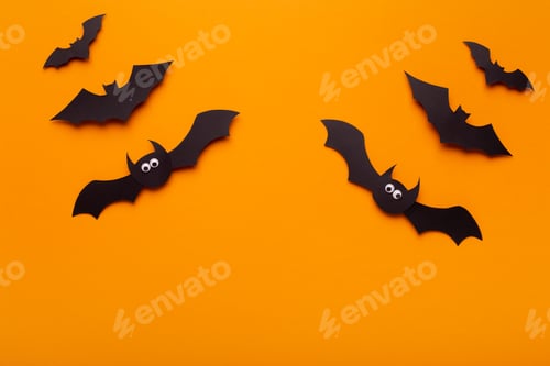 Preview: Creative composition of Halloween bats on orange background
