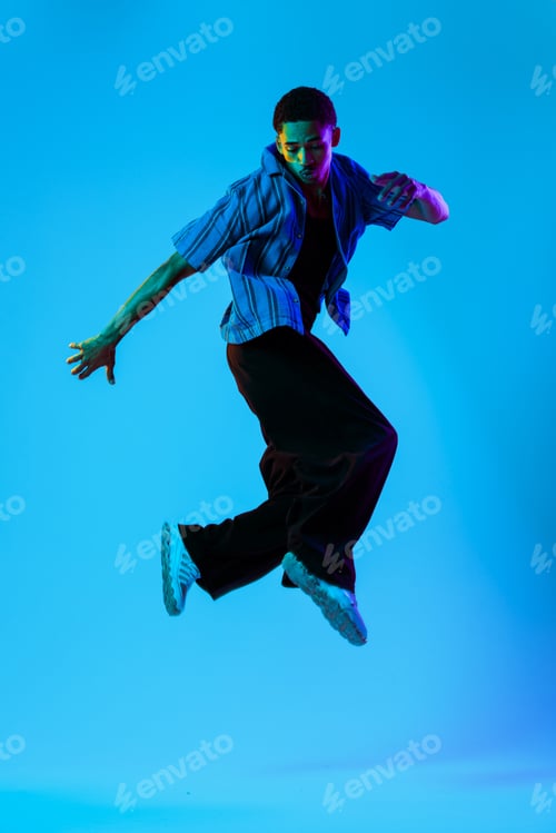 Preview: African man portrait in studio on colorful background