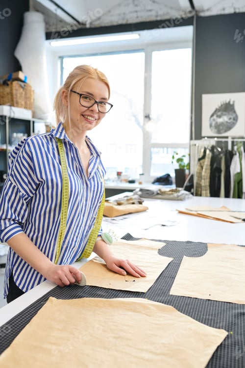 Preview: Female designer sewing dress