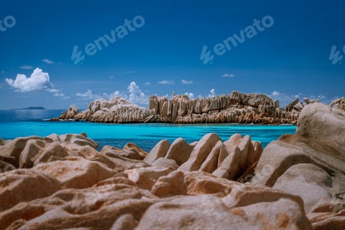 Preview: Seychelles La Digue. Scenery of amazing huge shaped granite rocks stones and blue turquoise ocean