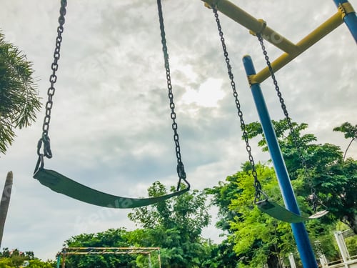 Preview: The Swing in playground on white cloud and green leave tree background