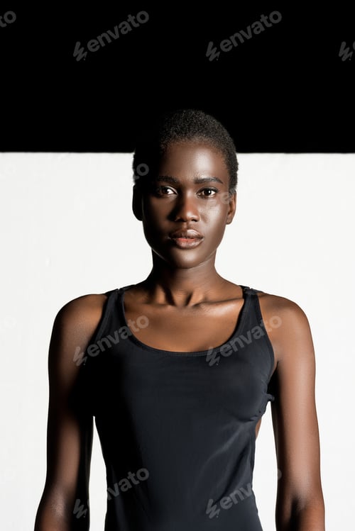 Preview: portrait of beautiful young african american woman looking at camera
