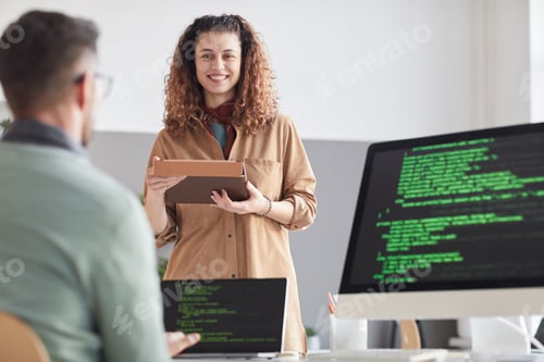 Preview: Programmers coding at office