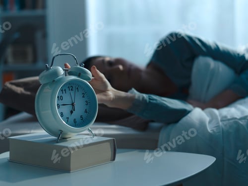Preview: Woman waking up in the morning and alarm clock