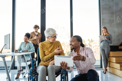 Preview: A diverse group of young professionals, including senior businesswomen entrepreneur in a wheelchair