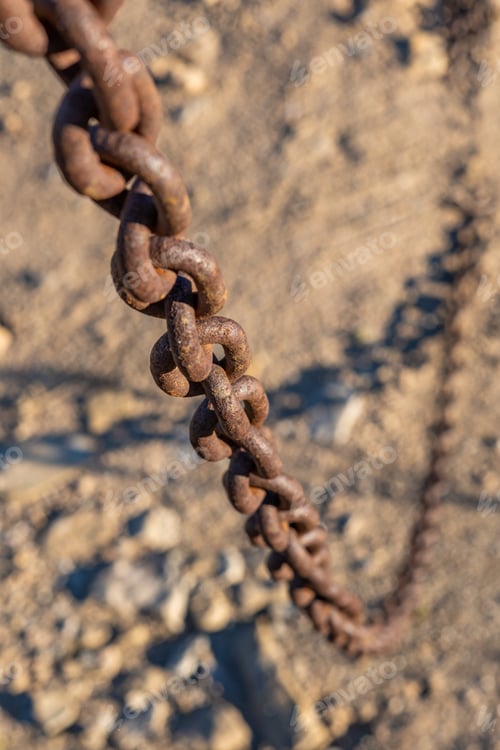 Preview: rusty chain hanging down cutting the passageway