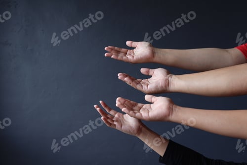 Preview: Hands of people ready to receive donation