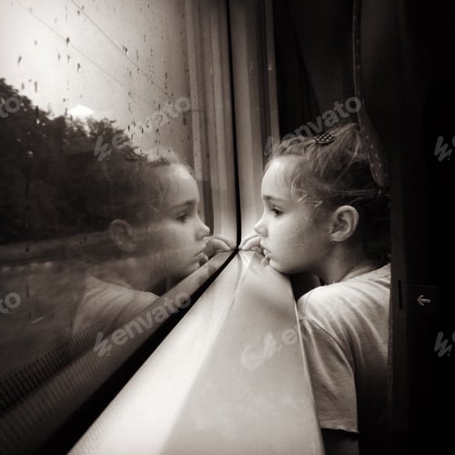 Preview: Reflection and thoughts . Little girl daughter sitting near window in train. Travel, voyage