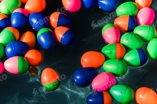 Preview: Plastic eggs floating in water