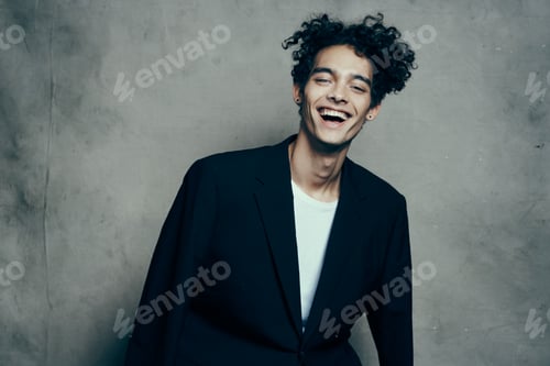 Preview: guy in suit curly hair t-shirt gray background model cropped view teenager