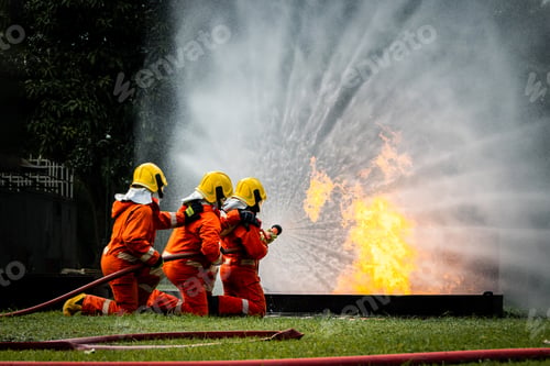 Preview: Firefighter Concept. Fireman using water and extinguisher to fighting with fire flame.
