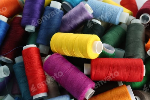 Preview: Pile of colorful sewing threads as background, closeup