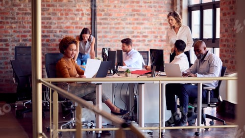 Preview: Business Team Working Together In Busy Multi-Cultural Office
