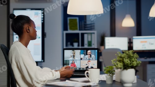 Preview: African businesswoman talking during video conference with team