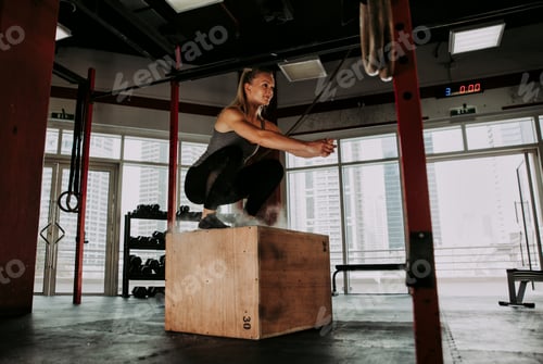 Preview: Beautiful young woman training at the gym