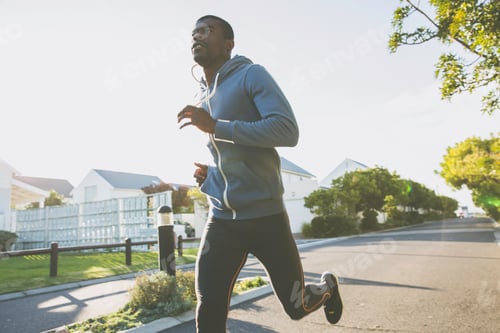 Preview: Man in residential area jogging