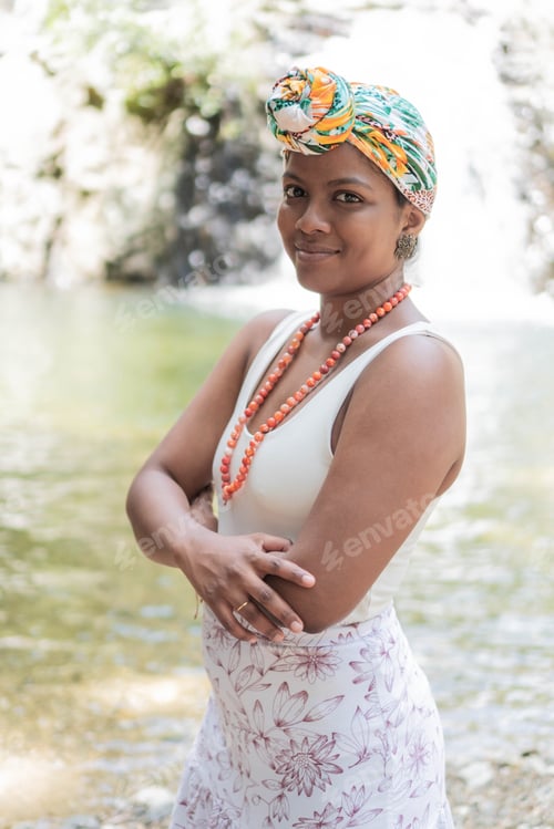 Preview: Stylish woman poses confidently wearing colorful headscarf