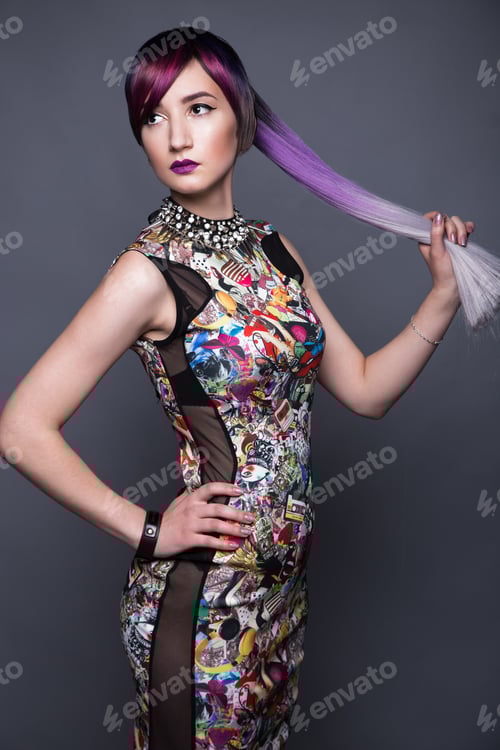 Preview: Beautiful girl in colorful dress with avant-garde hairstyles. Beauty the face.